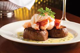 The Capital Grille signature dishes Seared Tenderloin with Butter Poached Lobster TailsPorcini-rubbed Bone-in Ribeye with 15-year Aged BalsamicSliced Filet Mignon with Cipollini Onions, Wild Mushrooms and Fig Essence